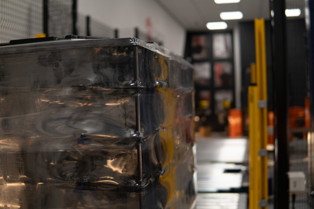 close up of film on a wrapped pallet coming off a Robopac autoline