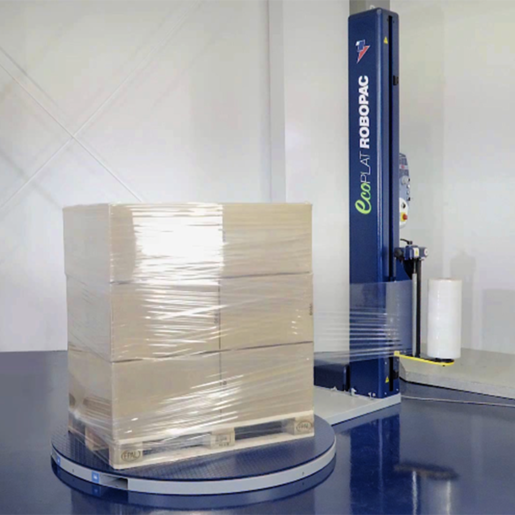 Ecoplat Plus turntable in action wrapping stretch film around a pallet of cardboard boxes