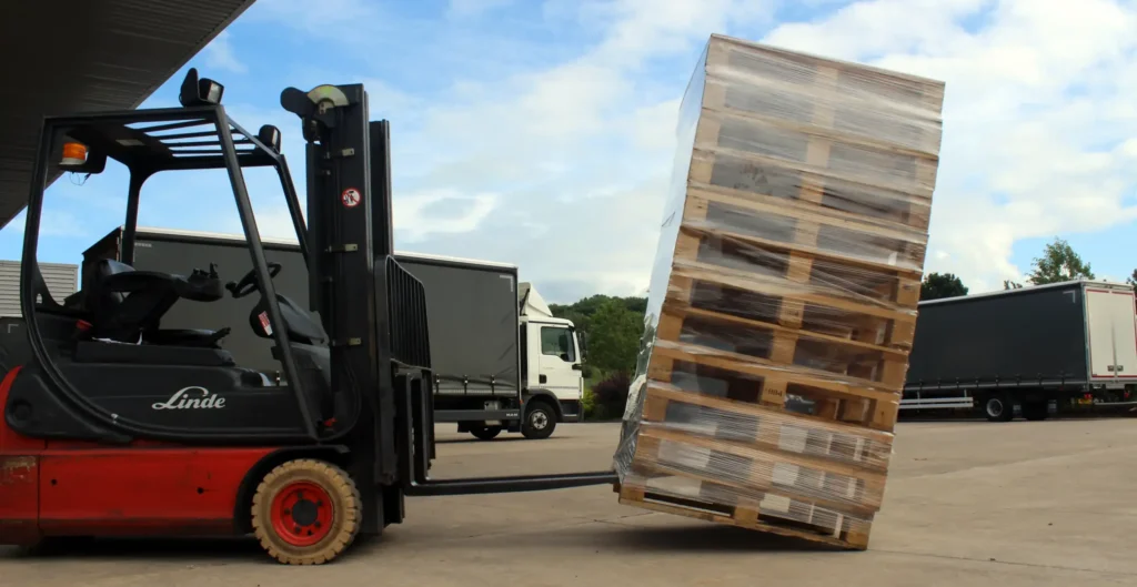 Forklift picking a stacked pallet