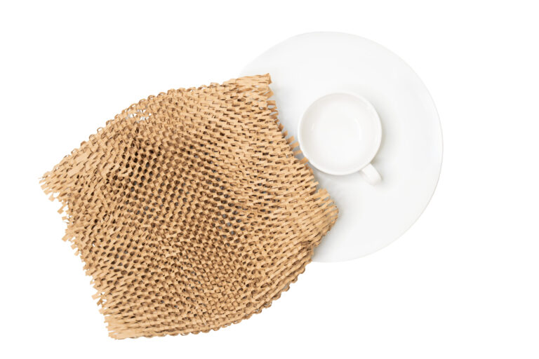 White tea cup and plate with Hexcel Wrap overlayed