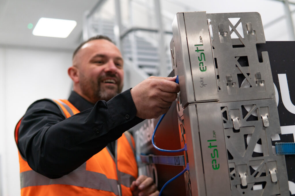 Technician installing an ESTL FEF-200 into a pallet