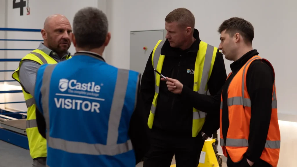 Castle Technical Team discussing pallet wrap in the Test Centre with a visitor