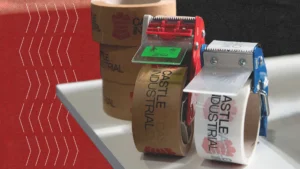 Castle Industrial branded masking tapes on white table with dispenser