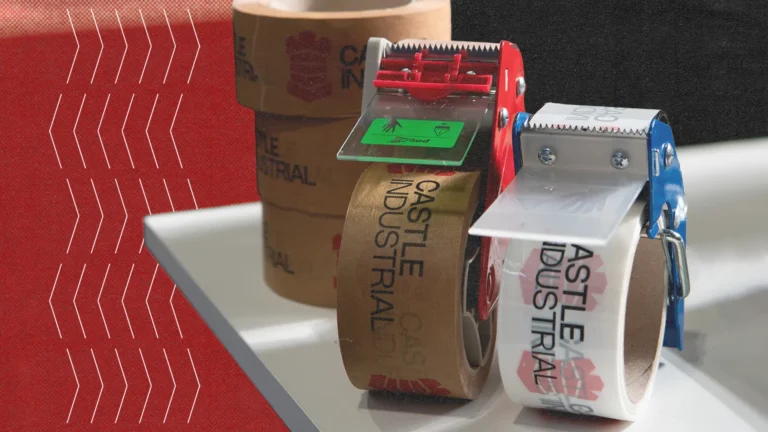 Castle Industrial branded masking tapes on white table with dispenser