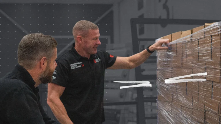 Load Stability experts examining the pallet wrap stretch percentage on a pallet